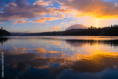 colorful sunrise on a calm lake © Niles B Photography
