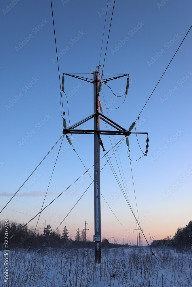 Fototapeta premium Transmitting tower of high-voltage line or power tower or electricity pylon in the field
