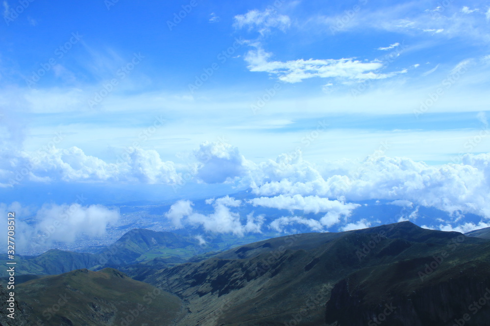 An andean mountain ridge with a stunning cloudscape and bright blue sky An andean mountain ridge with a stunning cloudscape and bright blue sky