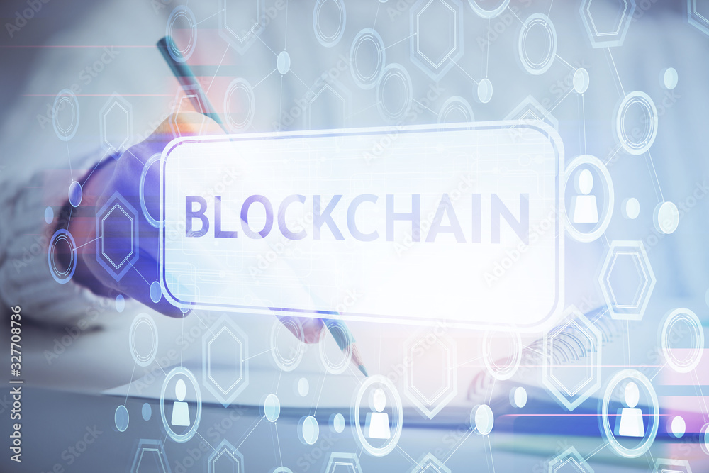 Cryptocurrency hologram, bitcoin, ico theme over hands taking notes background. Concept of blockchain. Multi exposure Cryptocurrency hologram, bitcoin, ico theme over hands taking notes background. Concept of blockchain. Multi exposure