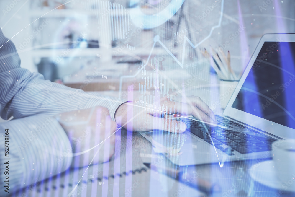 Multi exposure of stock market chart with man working on computer on background. Concept of financial analysis. Multi exposure of stock market chart with man working on computer on background. Concept of financial analysis.