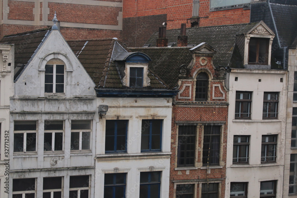 Fototapeta premium Top floors of old historical houses that are typical for old cities in the netherlands and belgium