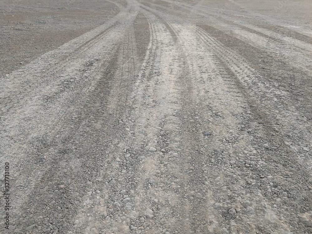 The road that has traces of wheels passing by The road that has traces of wheels passing by