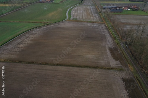 Large line of plowed fields full of water from the heavy rainfalls in the last days