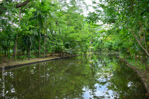 landscape of public park in the morning with view of water small pond
