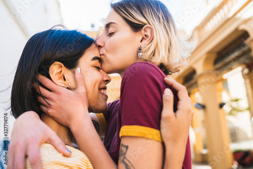 Loving lesbian couple at the street. photo