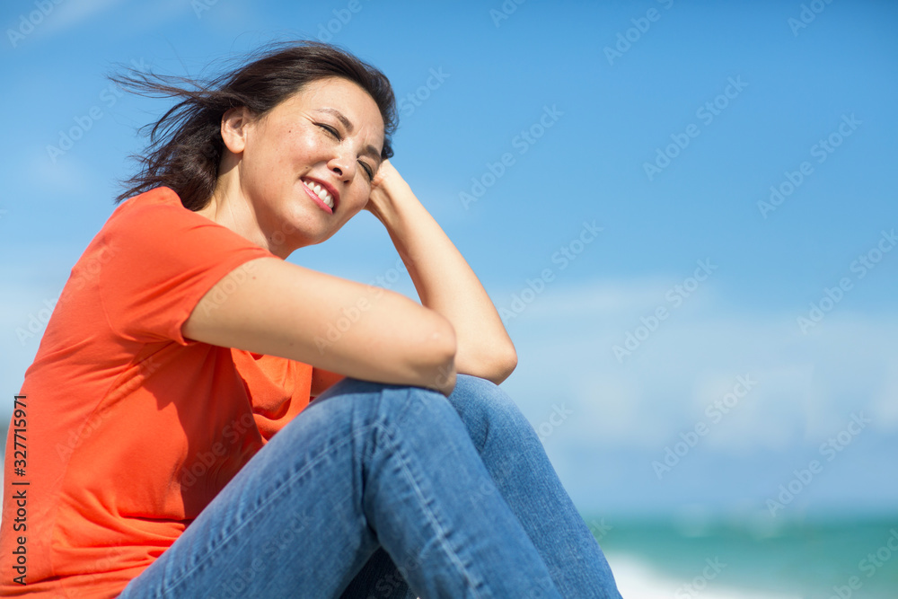Portrait of a happy confident Asian woman smiling. Portrait of a happy confident Asian woman smiling.