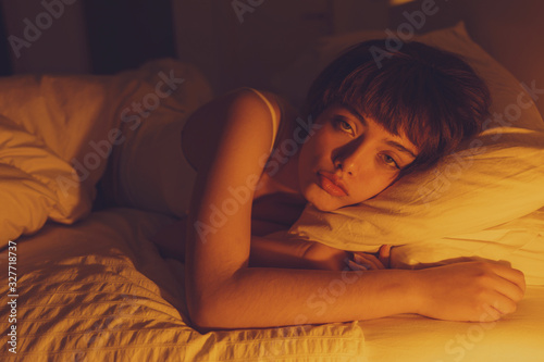 imsomnia concept young woman can not sleep at night