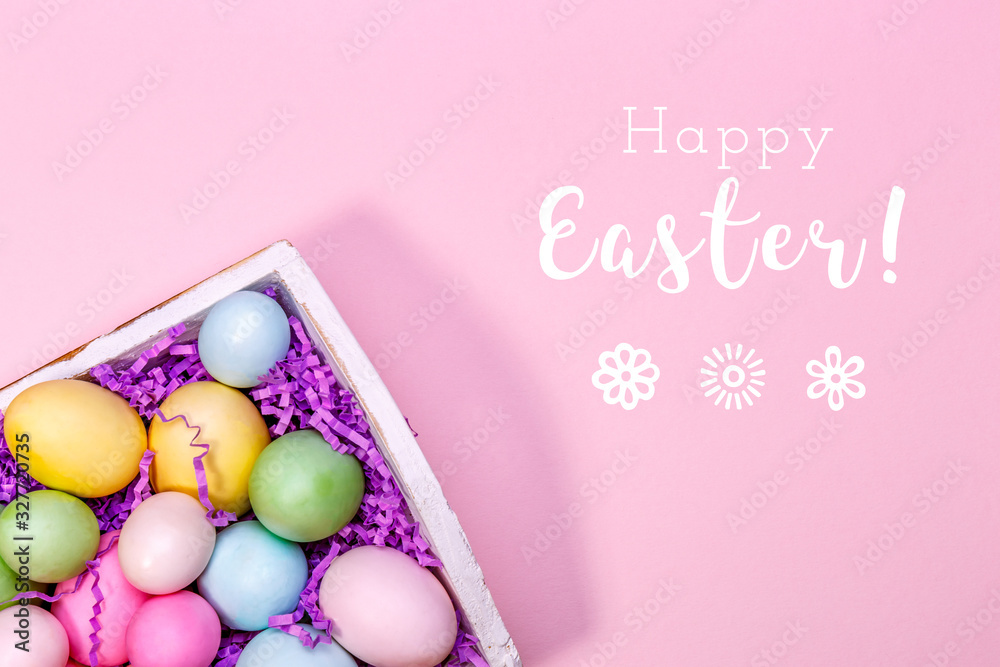 Multicolor eggs in a white tray. Creative Easter concept. Modern solid pink background. Horizontal Multicolor eggs in a white tray. Creative Easter concept. Modern solid pink background. Horizontal
