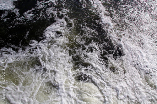  Water boiling in the river and foam due to a waterfall