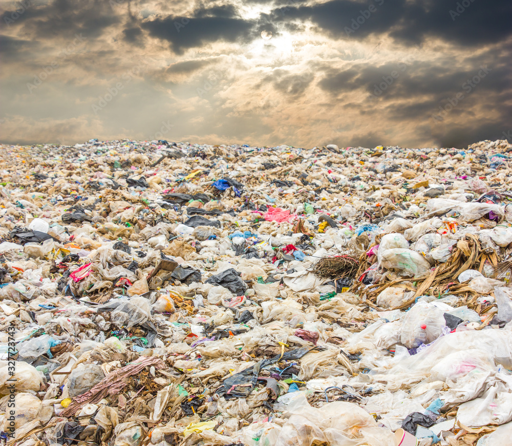 garbage dump pile in trash dump or landfill,truck is dumping the gabage from municipal,garbage with dark cloud ,pollution concept garbage dump pile in trash dump or landfill,truck is dumping the gabage from municipal,garbage with dark cloud ,pollution concept