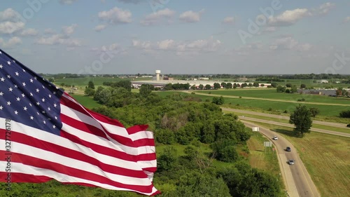 US flag aerial dolly to highway road with traffic, typical American concept