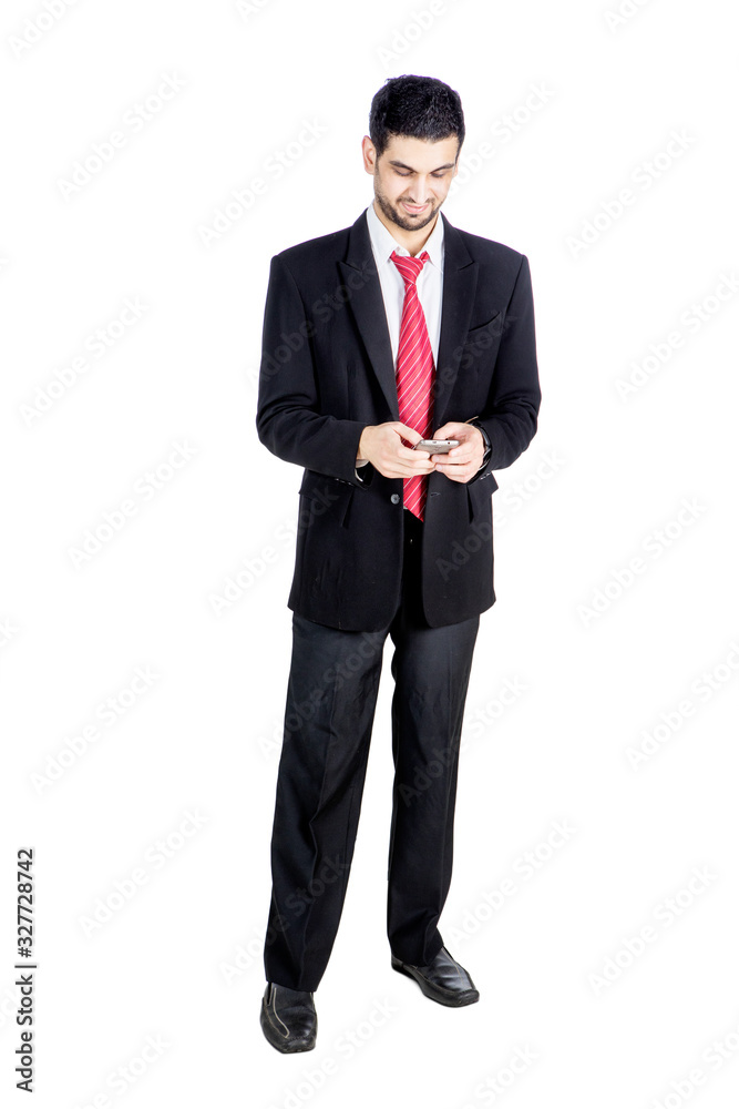 Handsome businessman reading message on cellphone Handsome businessman reading message on cellphone