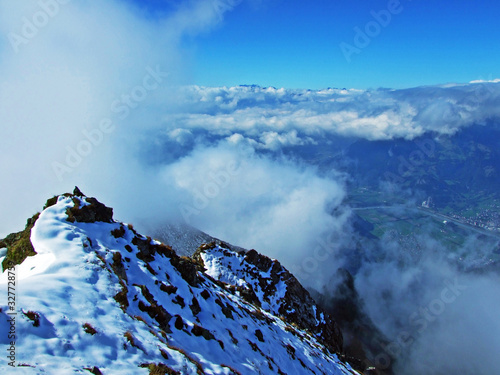 Above the clouds - view of the Rhine valley (Rheintal) from the Ratikon border mountain massif or Rätikon Grenzmassiv, Mainfeld - Canton of Grisons (Graubünden or Graubuenden), Switzerland photo