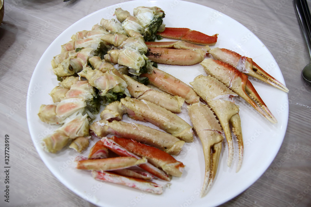 Trimmed snow crab dish on a white plate, in YeonDeok-Gun, South Korea. January 4, 2020.
