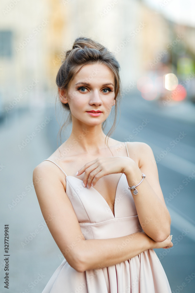 Fototapeta premium beautiful portrait of a young bride in a pink dress