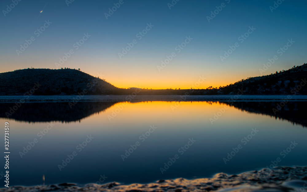 Sunset on the frozen lake