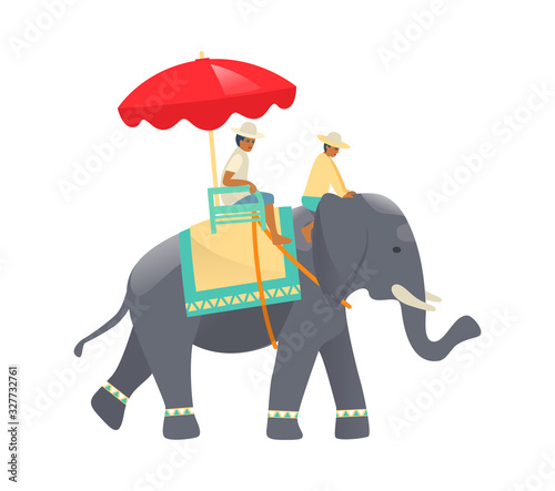 Traditional Thai elephant with beautiful decorative cloak, and riders.