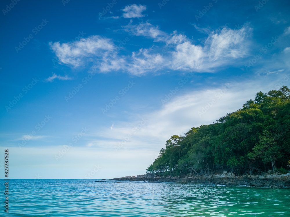 Beachfront next to a beautiful hill under a tree in a beautiful cloud day. Beachfront next to a beautiful hill under a tree in a beautiful cloud day.