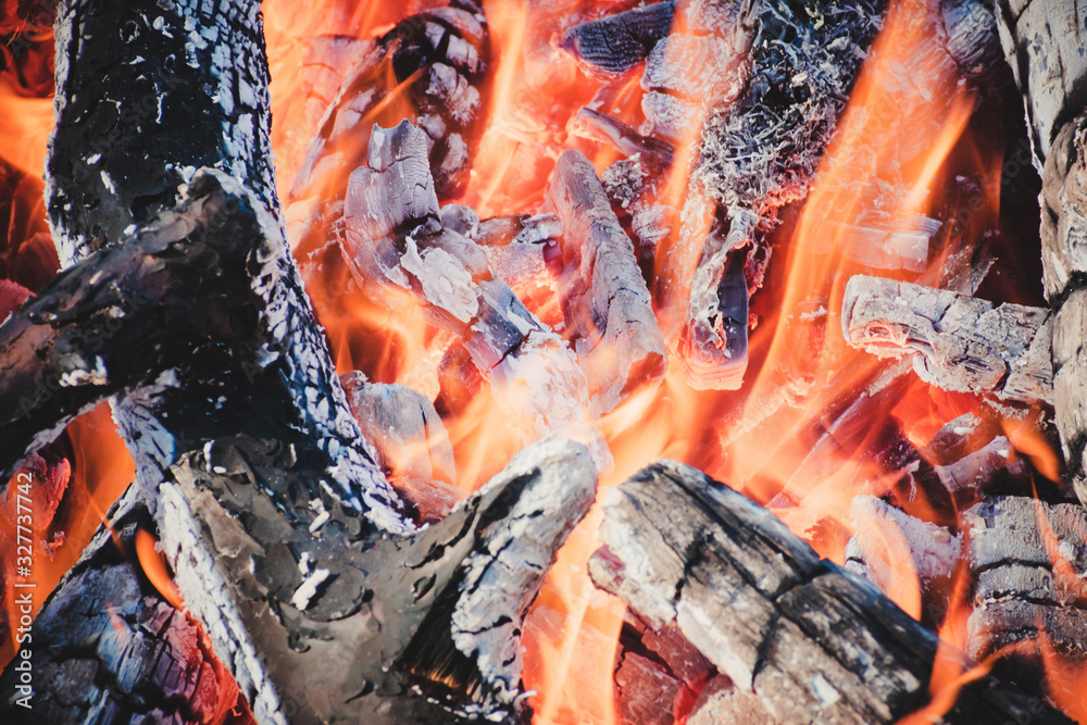 The burning charcoal. Hot fire close-up. Burning wood close-up. View of the fireplace inside. The burning charcoal. Hot fire close-up. Burning wood close-up. View of the fireplace inside.