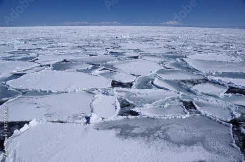 winter Seascape with ice floe and Shiretoko Peninsula in Hokkaido, Japan　流氷と知床連山　網走沖北海道