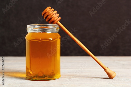 Jar of Honey with Honey Dipper photo