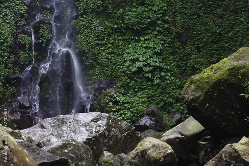 waterfall in the middle of the forest. waterfall flow. Beautiful natural waterfall