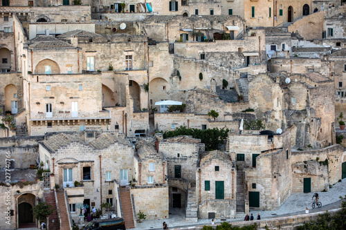 Fototapeta Naklejka Na Ścianę i Meble -  View of the Sassi di Matera a historic district in the city of Matera, well-known for their ancient cave dwellings. Basilicata. Italy
