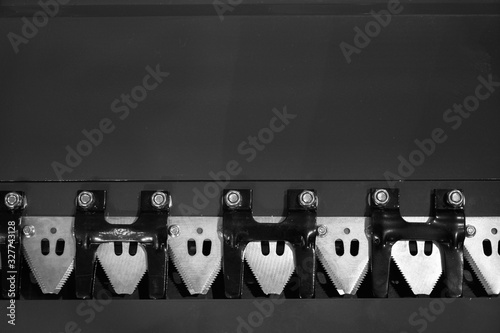 Cutters harvesting header. Agricultural equipment. Black and white image.