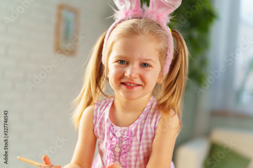 Portrait of a cute toddler girl with bunny ears