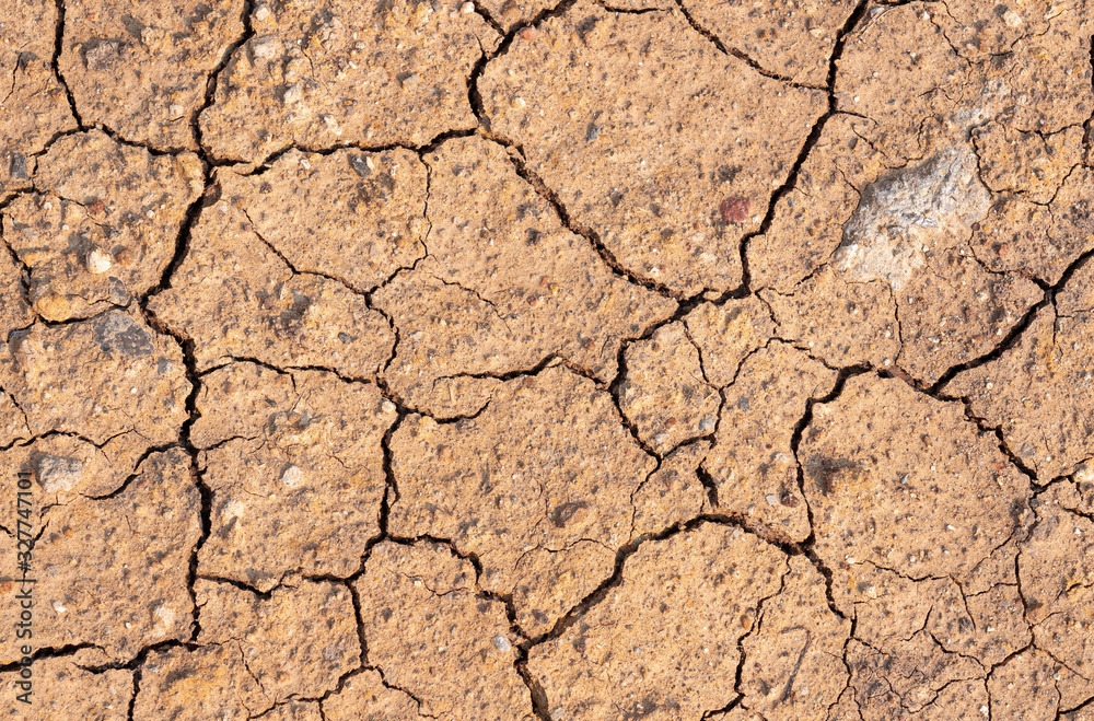 Surface of dry drought soil and ground cracked top view background. Surface of dry drought soil and ground cracked top view background.