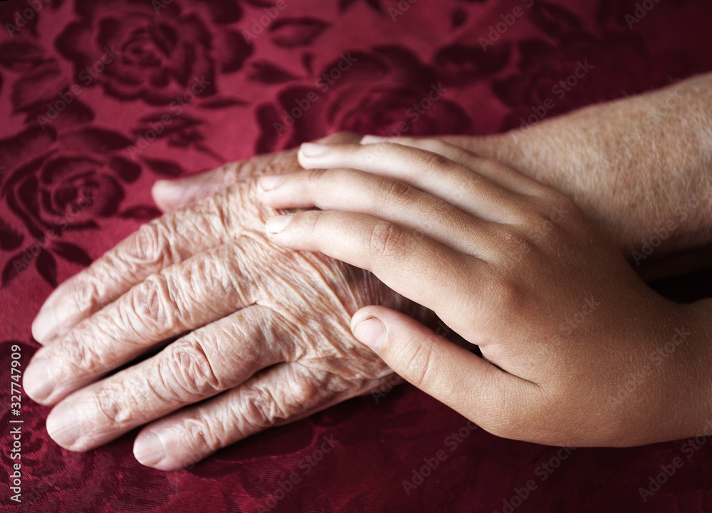 Fototapeta premium Two hands old and young