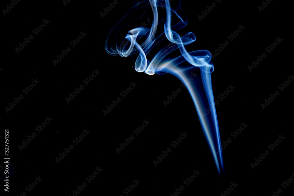 Abstract motion of white smoke isolated on a black background Can be modeled as hot food, smog, small clouds, and aromatic smoke. Abstract motion of white smoke isolated on a black background Can be modeled as hot food, smog, small clouds, and aromatic smoke.