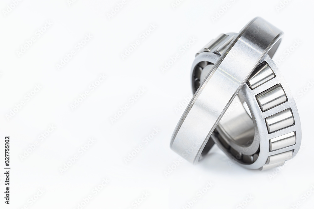 Close-up bearing spare part of mechanical on the white background.. Close-up bearing spare part of mechanical on the white background..