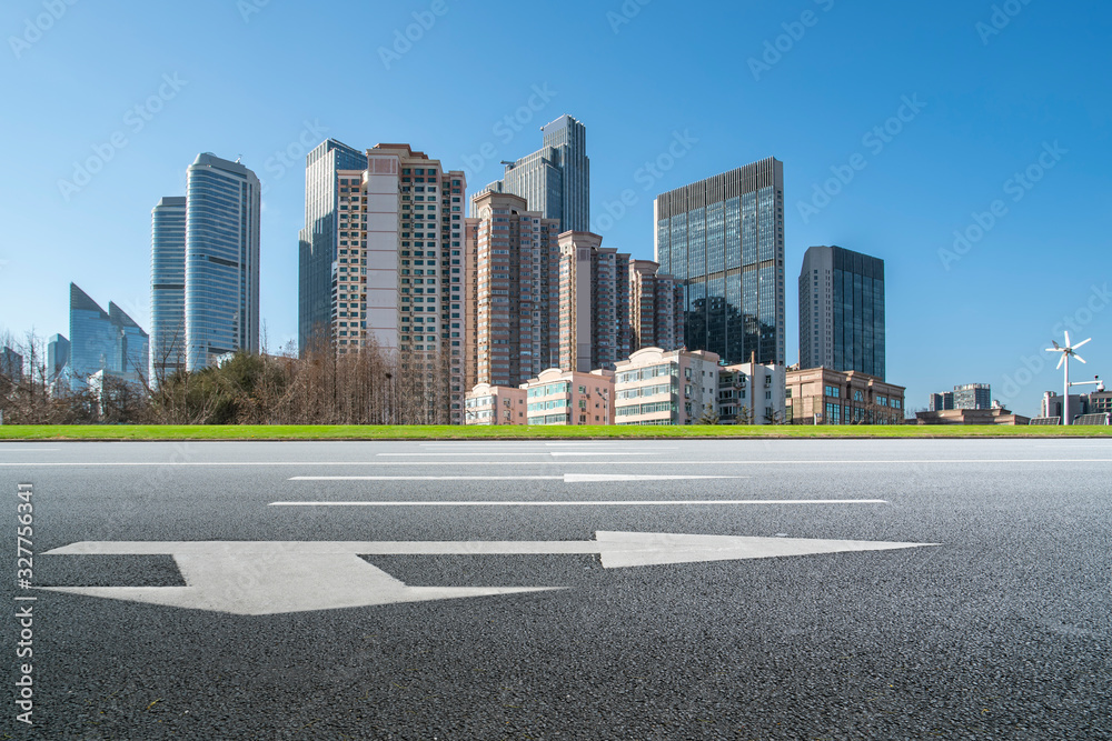 Qingdao urban skyline and asphalt road architectural landscape..