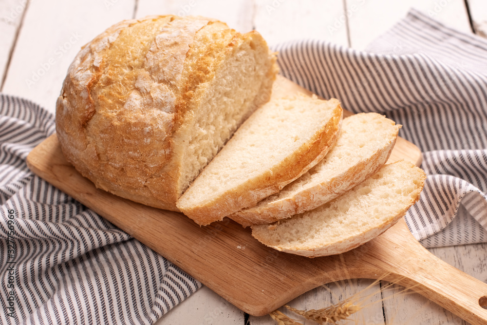 Fresh bread on wooden table. Top view with space for your text