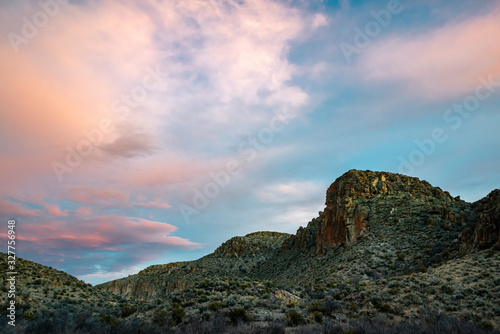 USA, Nevada, Lincoln County, Basin and Range National Monument. A brilliant blue and pink pastel sunset in Wrong Way Canyon.