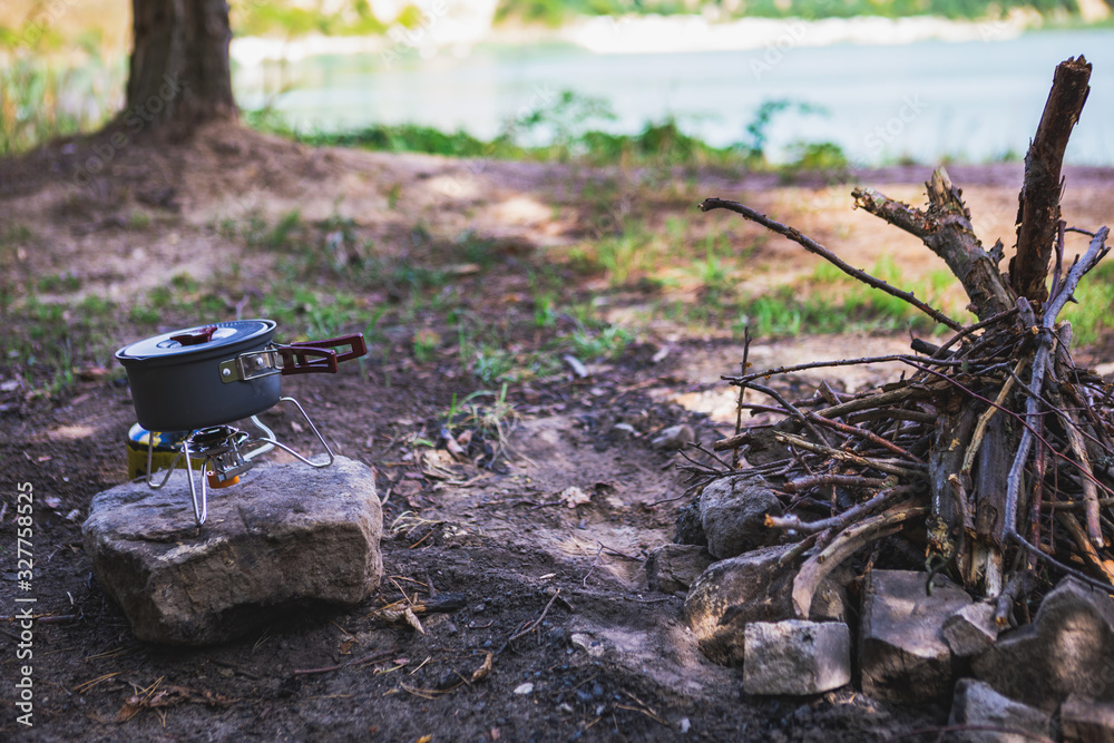 view of cooking pan outdoors near camp fire view of cooking pan outdoors near camp fire