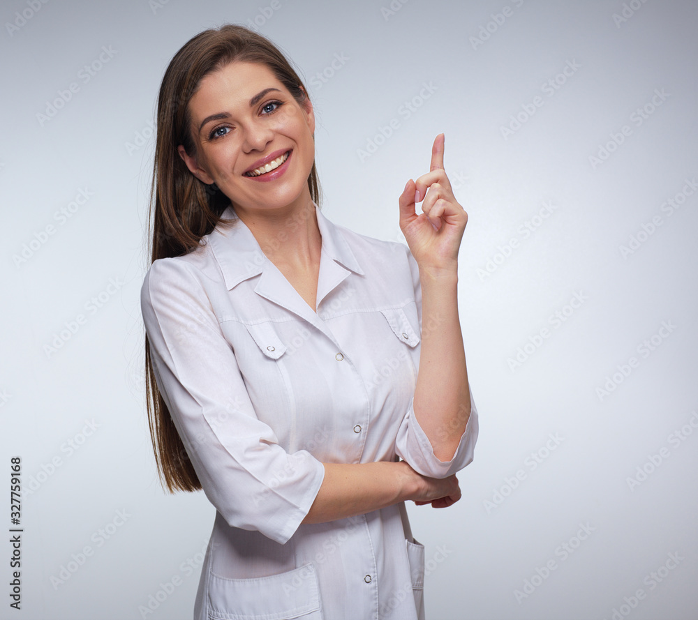 Woman doctor wearing white medical uniform pointing with finger. Woman doctor wearing white medical uniform pointing with finger.