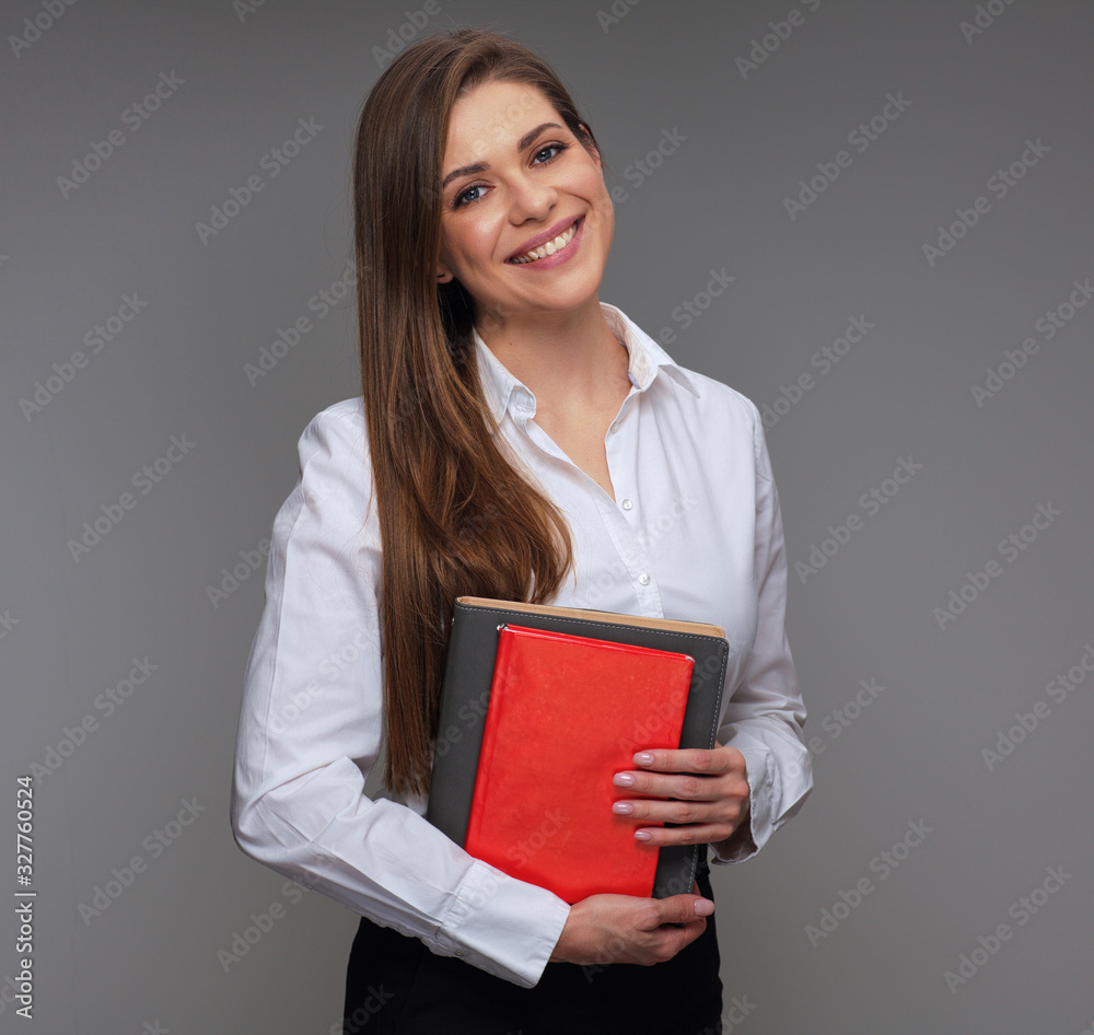 Smiling teacher woman holding red book. isolated portrait Smiling teacher woman holding red book. isolated portrait