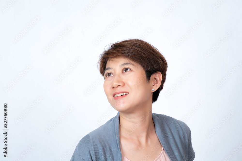 Portrait of short-haired Asian woman smiling side-facing On a white background Portrait of short-haired Asian woman smiling side-facing On a white background