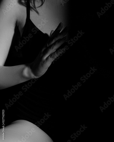 Girl's hand on a black background