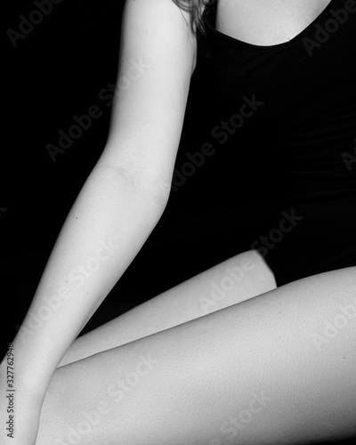  Legs of a girl in the form of geometric lines on a black background