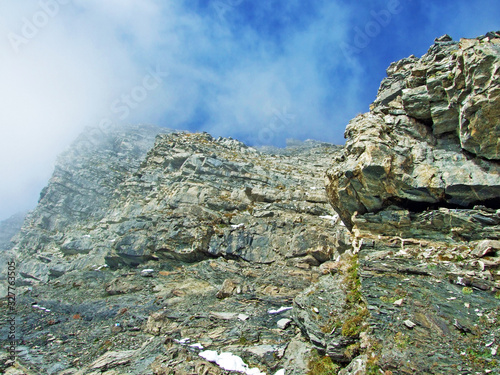 Rocks and stones on the Ratikon border alpine mountain massif or Rätikon Grenzmassiv (oder Raetikon), Mainfeld - Canton of Grisons (Graubünden or Graubuenden), Switzerland photo