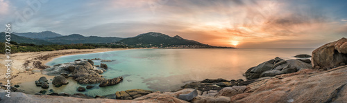 Sunset over beach and village of Algajola in Corsica