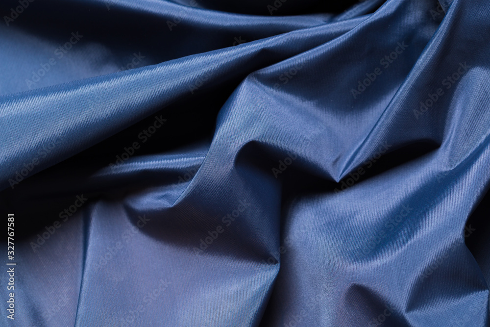 Blue fabric cloth texture. abstract texture background with soft waves.