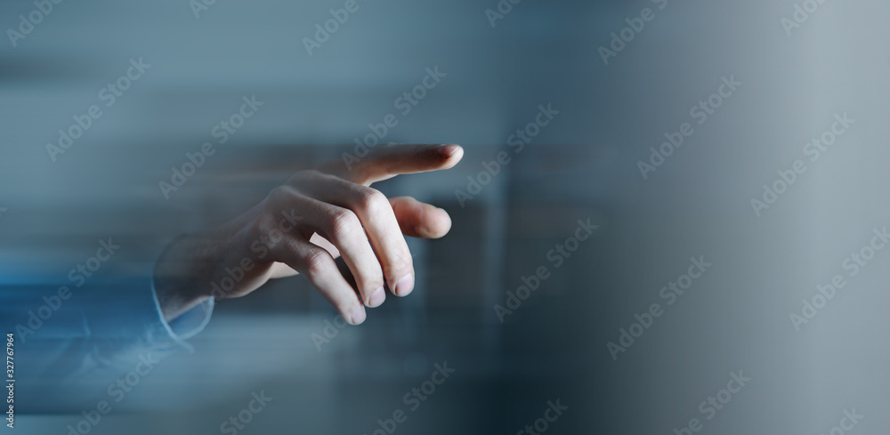 business man presses on touch screen - obrazy, fototapety, plakaty 