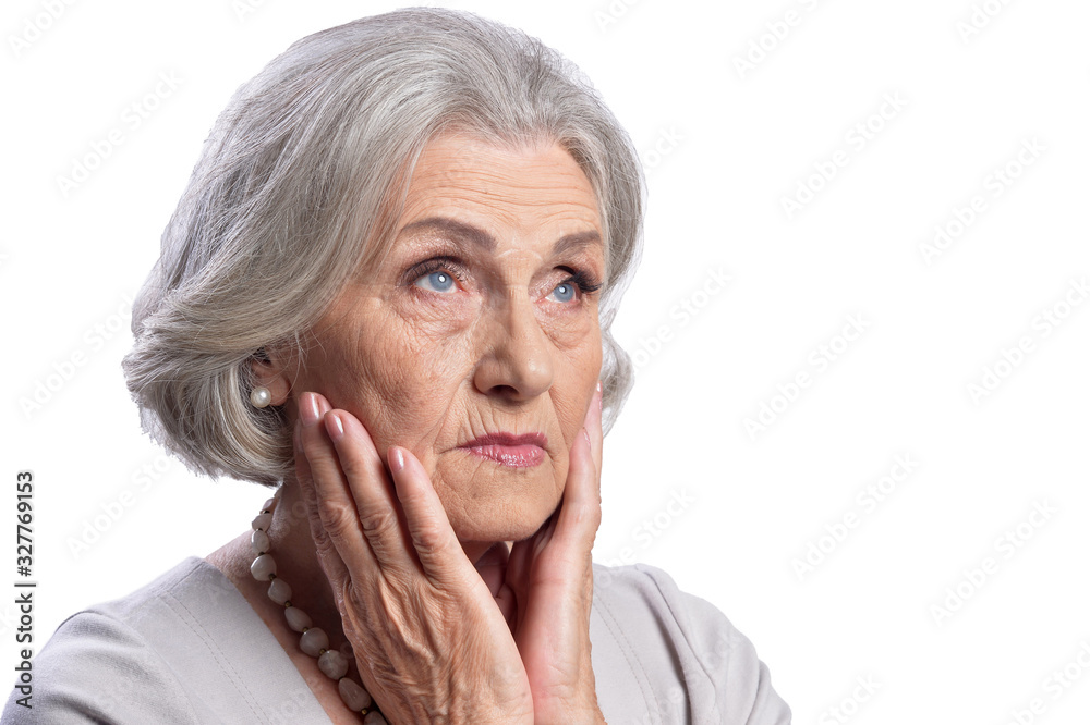 Sad senior woman posing isolated on white background Sad senior woman posing isolated on white background