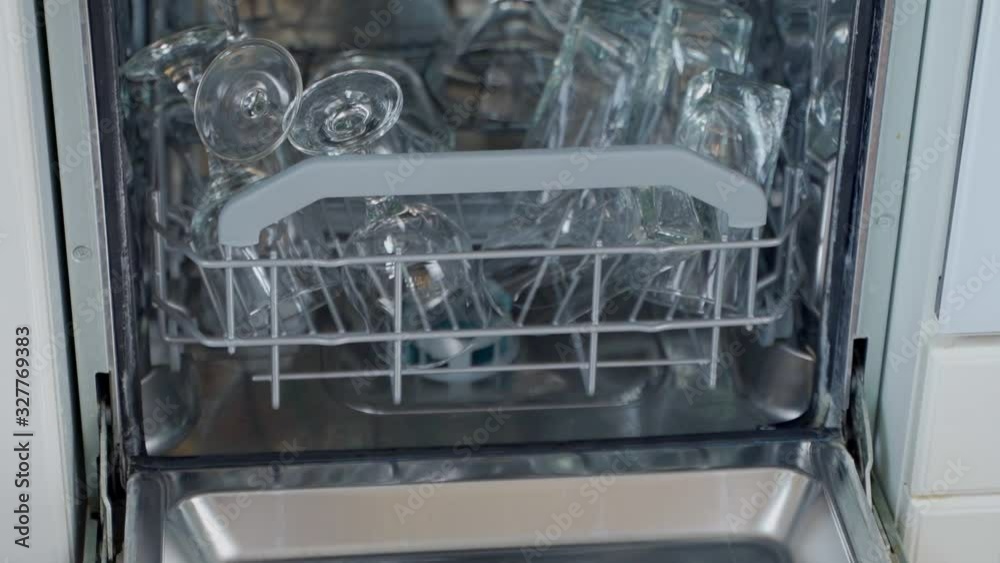 Clean glasses and cups after washing in a dishwasher machine. Close-up shot