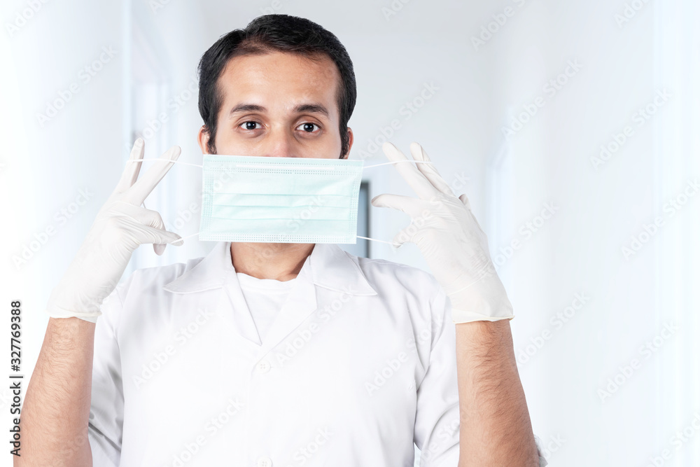 Asian doctor man in protective gloves wearing flu - obrazy, fototapety, plakaty 